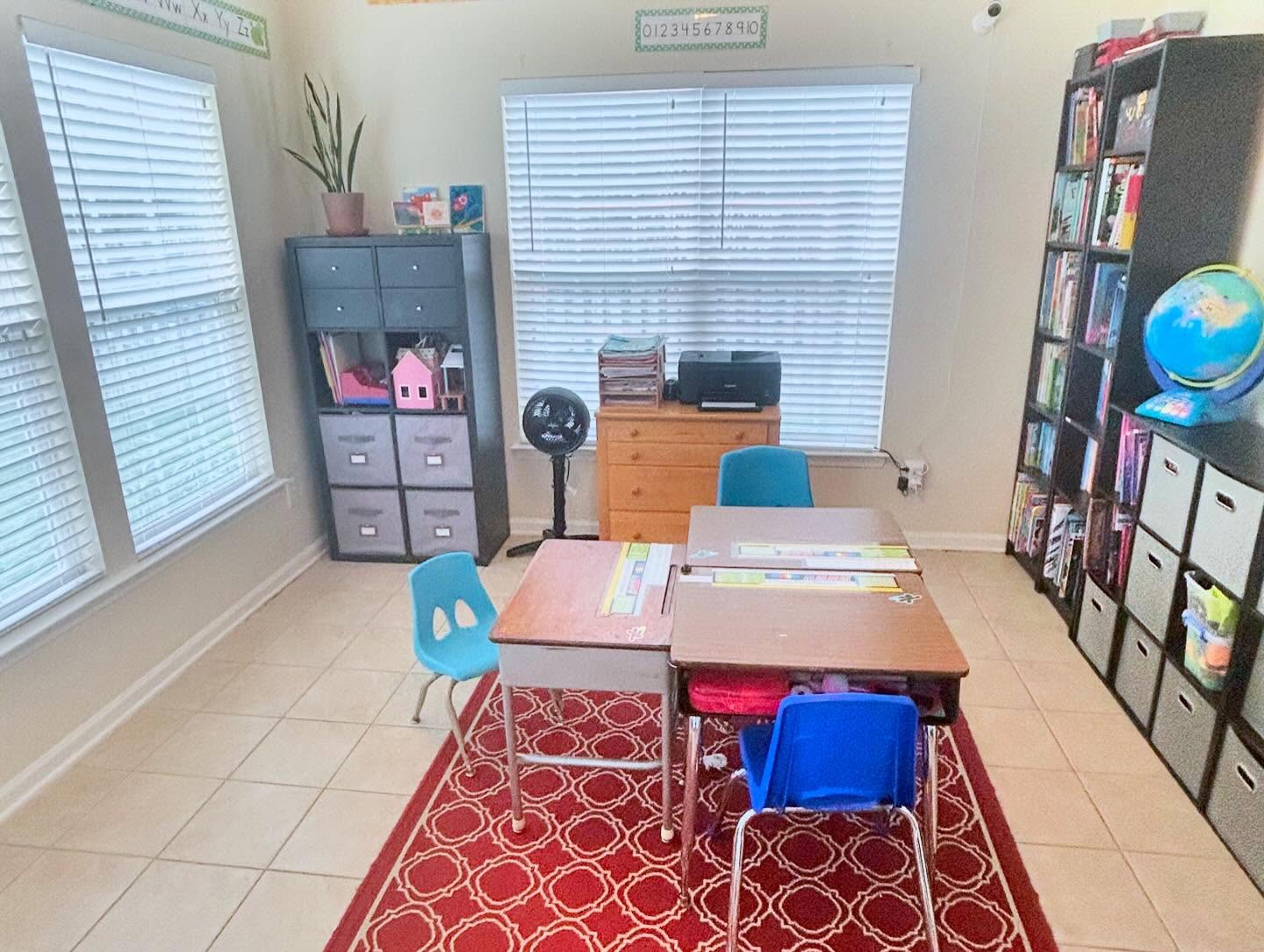 Minimalist homeschool classroom after organizing — neat desks, styled storage, and a peaceful workspace for kids